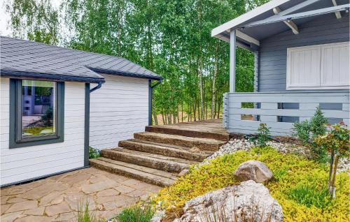 a home with stairs leading to a house at Nice Home In Insko With Sauna in Ińsko