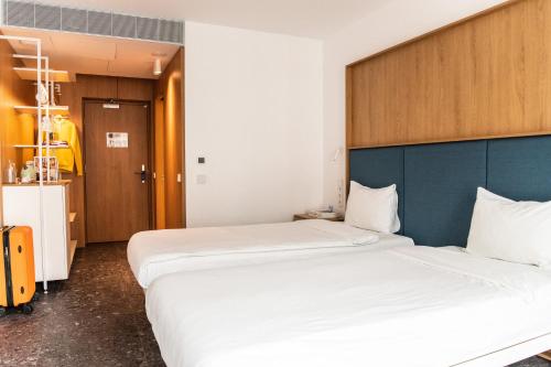 two beds in a hotel room with two beds sidx sidx sidx at Hotel Kitchen59 in Sofia