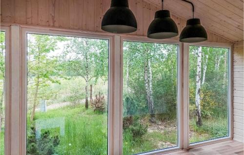 a window in a house with two lights at Nice Home In Insko With Sauna in Ińsko