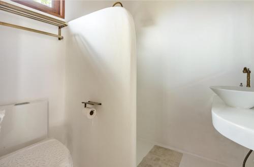 a white bathroom with a sink and a toilet at lory‘s home in Bangkok