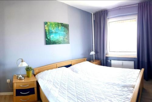 Postel nebo postele na pokoji v ubytování Hanseat I App 82