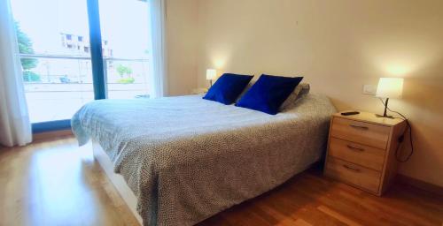 Ένα ή περισσότερα κρεβάτια σε δωμάτιο στο Apartamento playa Cabodeiro, en A Illa De Arousa