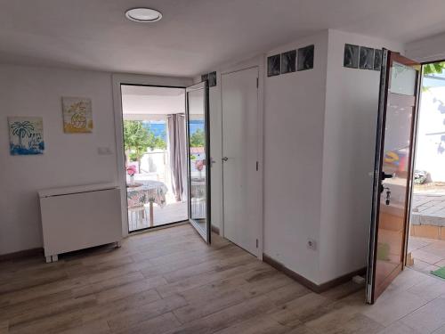 a room with a hallway with sliding glass doors at A Casiña do Antonio in Nigrán