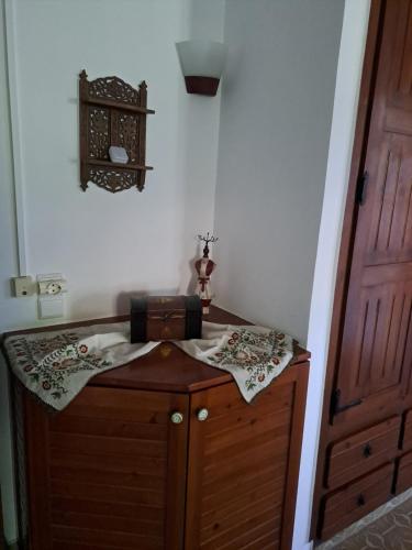 a small room with a wooden cabinet and a door at Villa Anesis-Παραθαλάσσια βίλα in Amaliás