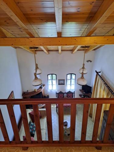 an attic view of a living room with wooden ceilings at Villa Anesis-Παραθαλάσσια βίλα in Amaliás