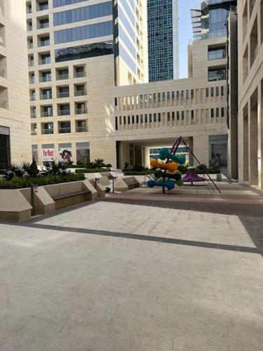 a large plaza in a city with tall buildings at Modern studio in the heart of Amman in Amman