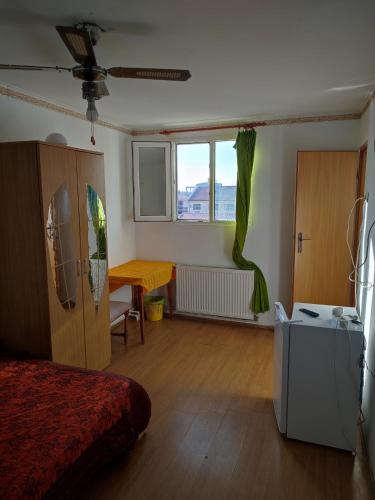 a room with a bed and a table in it at Hostel EMY Camere cu baie proprie aproape de plaja 3 Papuci in Constanţa