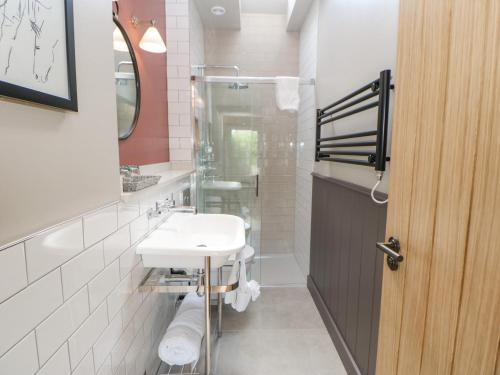 a bathroom with a sink and a shower at Bolton in Appleby