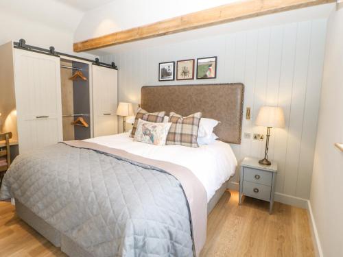 a bedroom with a large bed in a room at Marton in Appleby