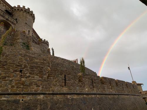 a rainbow over the side of a castle at Domus Petra in Rocca Cilento