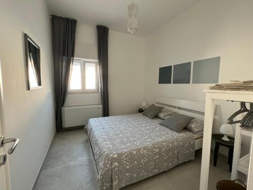 Ένα ή περισσότερα κρεβάτια σε δωμάτιο στο Casa Flavia