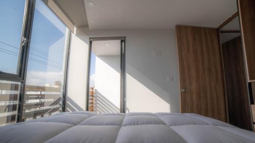 Ένα ή περισσότερα κρεβάτια σε δωμάτιο στο Missum Versatile Living