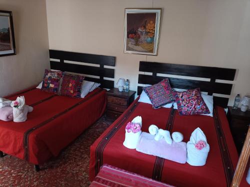 Postel nebo postele na pokoji v ubytování HOSTAL LA PAZ