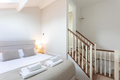 Postel nebo postele na pokoji v ubytování Cobble Cottage