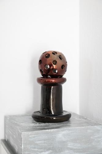 a metal object sitting on top of a table at Sea Lilies Suites in Plaka