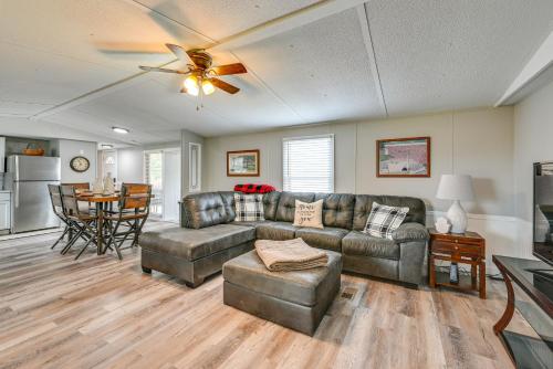 a living room with a couch and a table at Kentucky Vacation Rental Half-Mi to Mammoth Cave! in Sloans Crossing