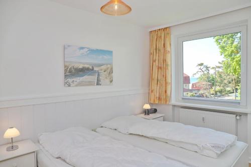 Postel nebo postele na pokoji v ubytování Strandschloss App 39