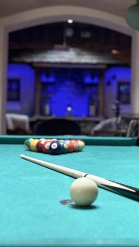 two cue balls on a snooker pool table at Alpines Lifestyle Hotel Tannenhof in Sankt Johann im Pongau