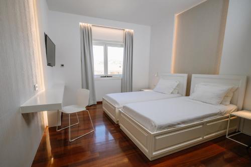 Giường trong phòng chung tại BlueGreen Villa