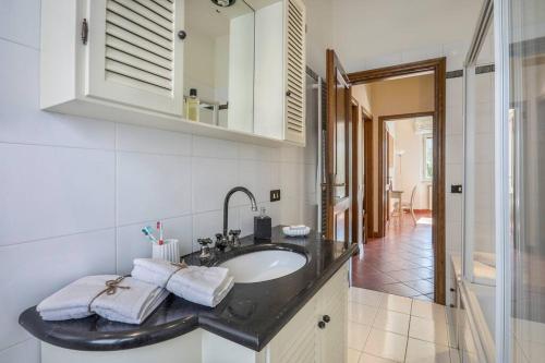 a bathroom with a sink and a mirror at Villa Luis in Pietrasanta