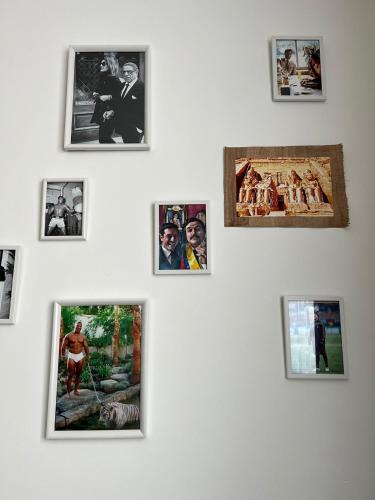a group of pictures on a white wall at Moderne Wohnung mit 4 Betten in Bochum