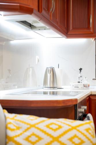 a kitchen with a tea kettle on a counter at Seaside Guesthouse in Kavála
