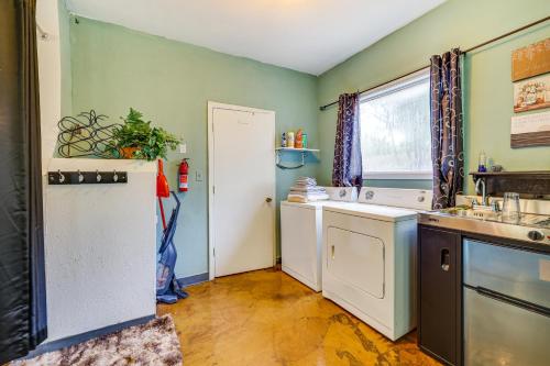 a kitchen with a sink and a refrigerator at Springdale Vacation Rental about 9 Mi to Fayetteville! in Springdale