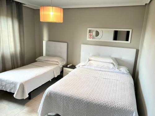 Postel nebo postele na pokoji v ubytování Hostal la Picota