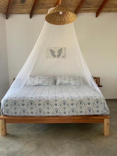 En eller flere senge i et værelse på villa colibri