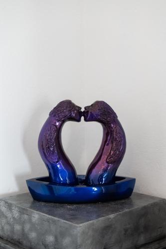a purple glass sculpture in the shape of a heart at Sea Lilies Suites in Plaka