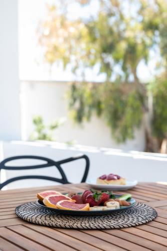 two plates of food are sitting on a table at Sea Lilies Suites in Plaka
