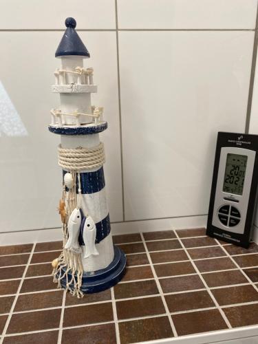 a lighthouse cake on top of a kitchen counter at Unter dem Dach mit Parkplatz in Bremen