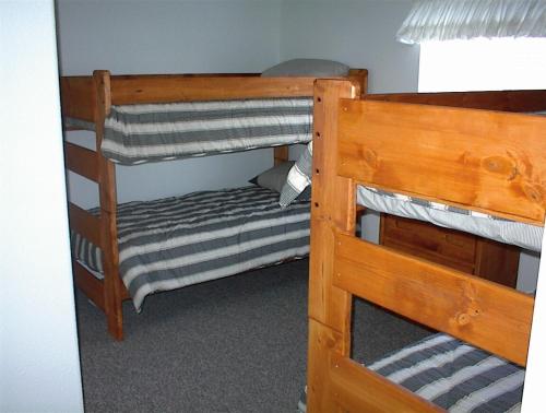a couple of bunk beds in a room at Waterfront Colorado River Home With Private Dock! in Needles