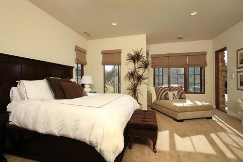 a large bedroom with a large bed and a couch at Stunning Rancho Mirage Hilltop Compound in Rancho Mirage