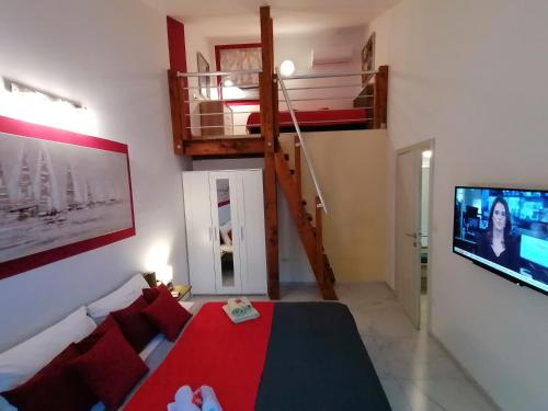 a living room with a couch and a tv and a staircase at The Forest House Krk 2 in Kras