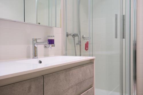 a bathroom with a sink and a shower at Hubertus 112 in Obergesteln