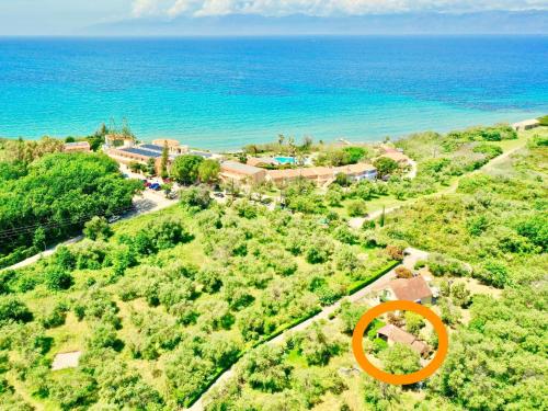 an orange sign on a hill near the ocean at Renas Studio near Roda by DadoVillas in Roda