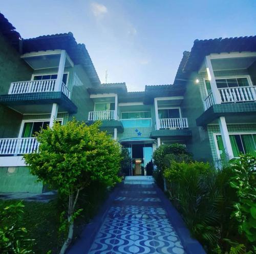 a house with a walkway in front of it at Varandas Lagoa Azul in Araruama