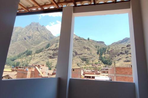 a view of a mountain view from a window at Departamento privado cerca a la plaza in Pisac
