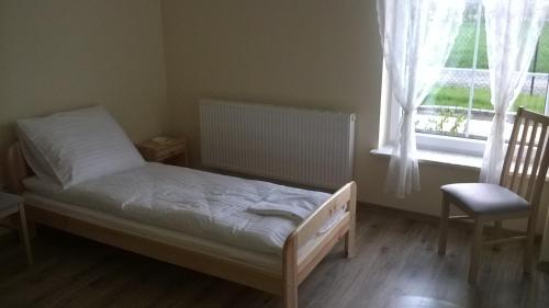 Postel nebo postele na pokoji v ubytování Praski Dom