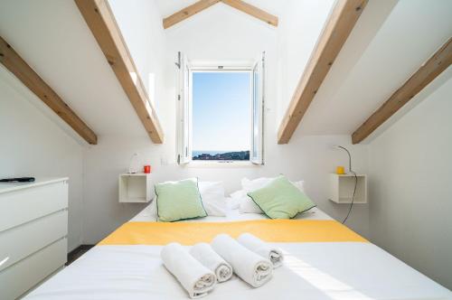 a bedroom with two beds and a window at Dubrovnik Icy Guest House in Dubrovnik