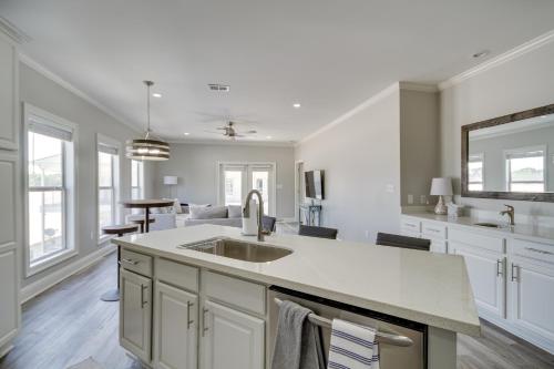 a kitchen with white cabinets and a sink at Pet-Friendly Vacation Rental in Biloxi Near Beach! in Biloxi