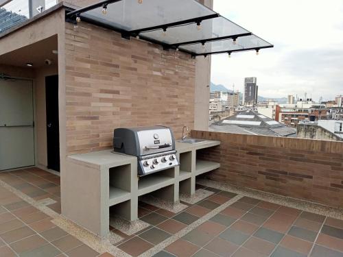 a grill on the rooftop of a building at Descanso en el Centro Historico in Bogotá