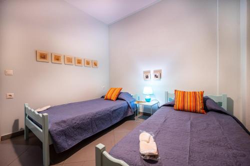 Postel nebo postele na pokoji v ubytování Filoxenos Apartment
