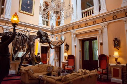 a living room with a statue of an elephant in a room at Quernmore Park Hall in Lancaster