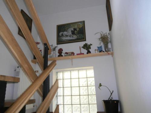 a room with a staircase with a window at Apartment Žvan in Bohinj