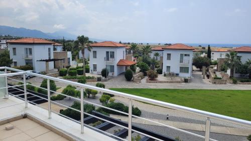 a view from the balcony of a apartment building at Sea and Mountain View Beachfront Penthouse in Yalı