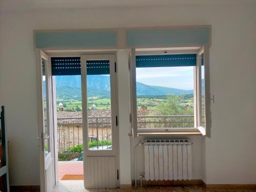 a door leading to a balcony with a view at Ca' del Laki in Caprino Veronese