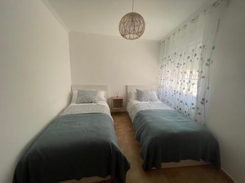 Postel nebo postele na pokoji v ubytování Casa cesar