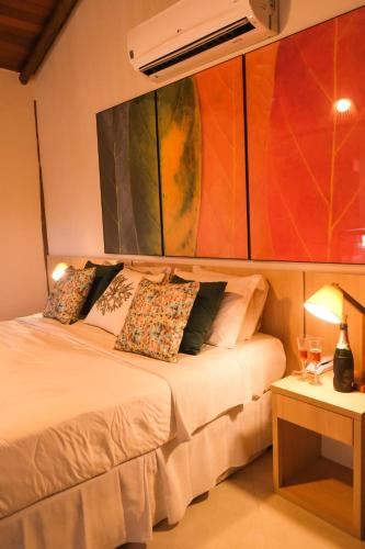 Una cama o camas en una habitación de Abricó Beach Hotel